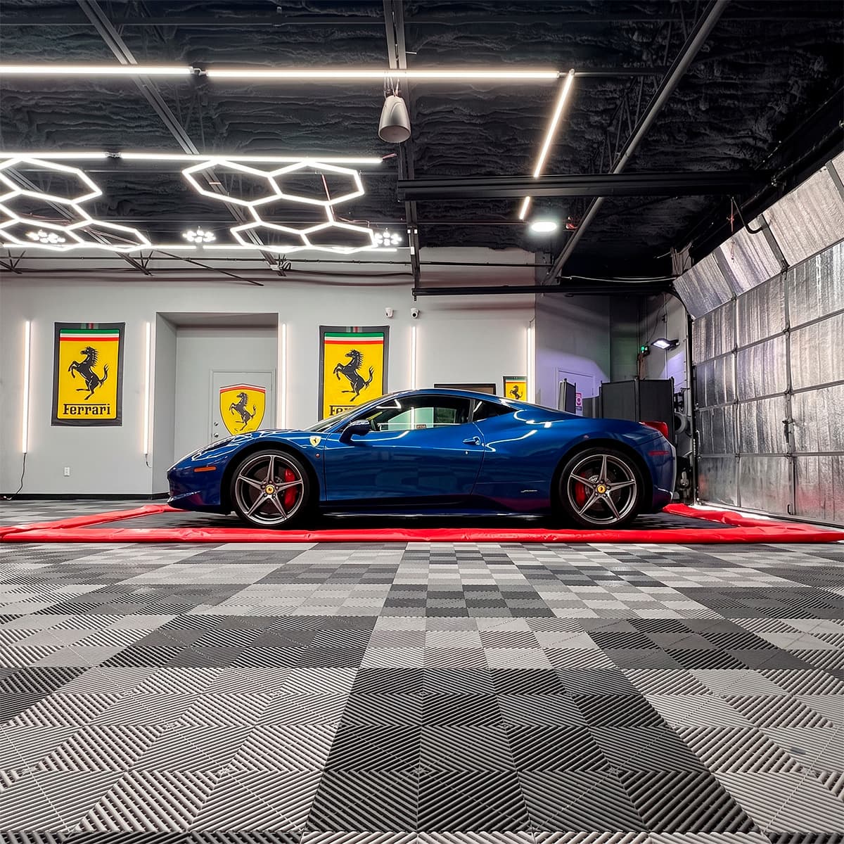 DGARAGE signature checkerboard floor with exotic vehicle on display