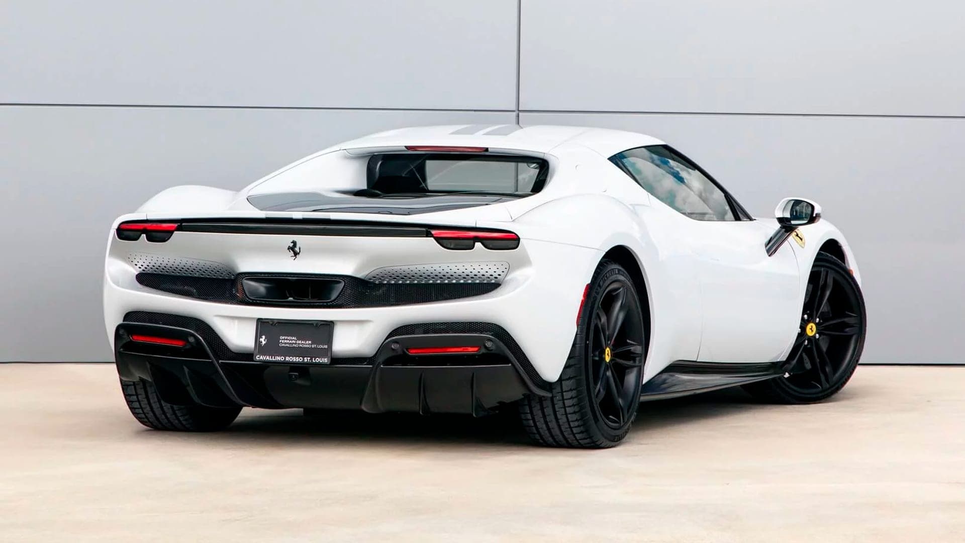 White Ferrari 296 GTB rear three-quarter view