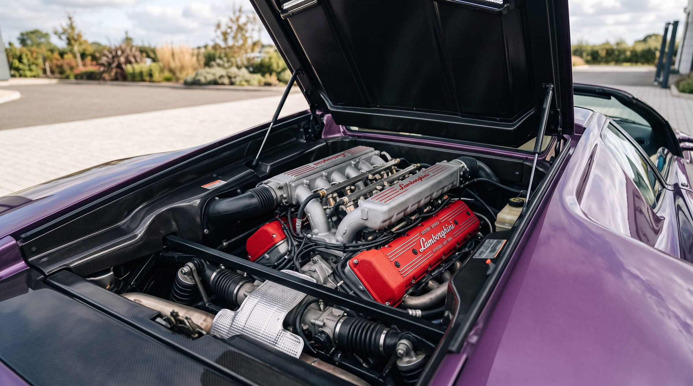 Lamborghini Diablo V12 engine bay with red intake covers