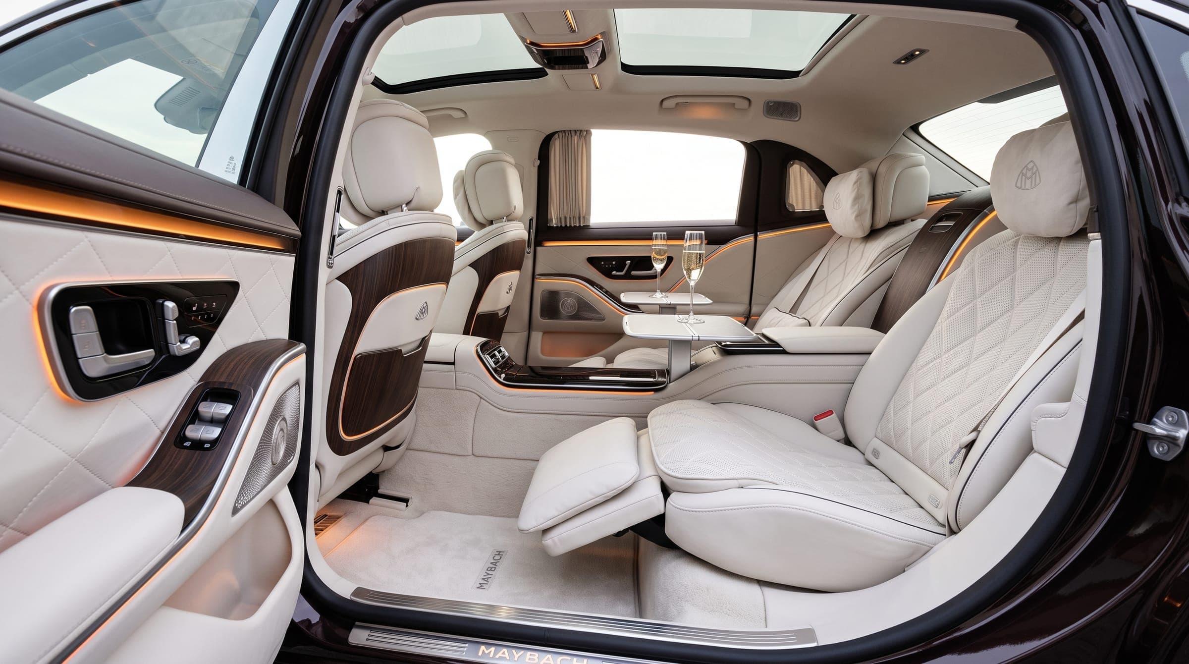 Luxury sedan rear cabin with quilted white leather executive seats